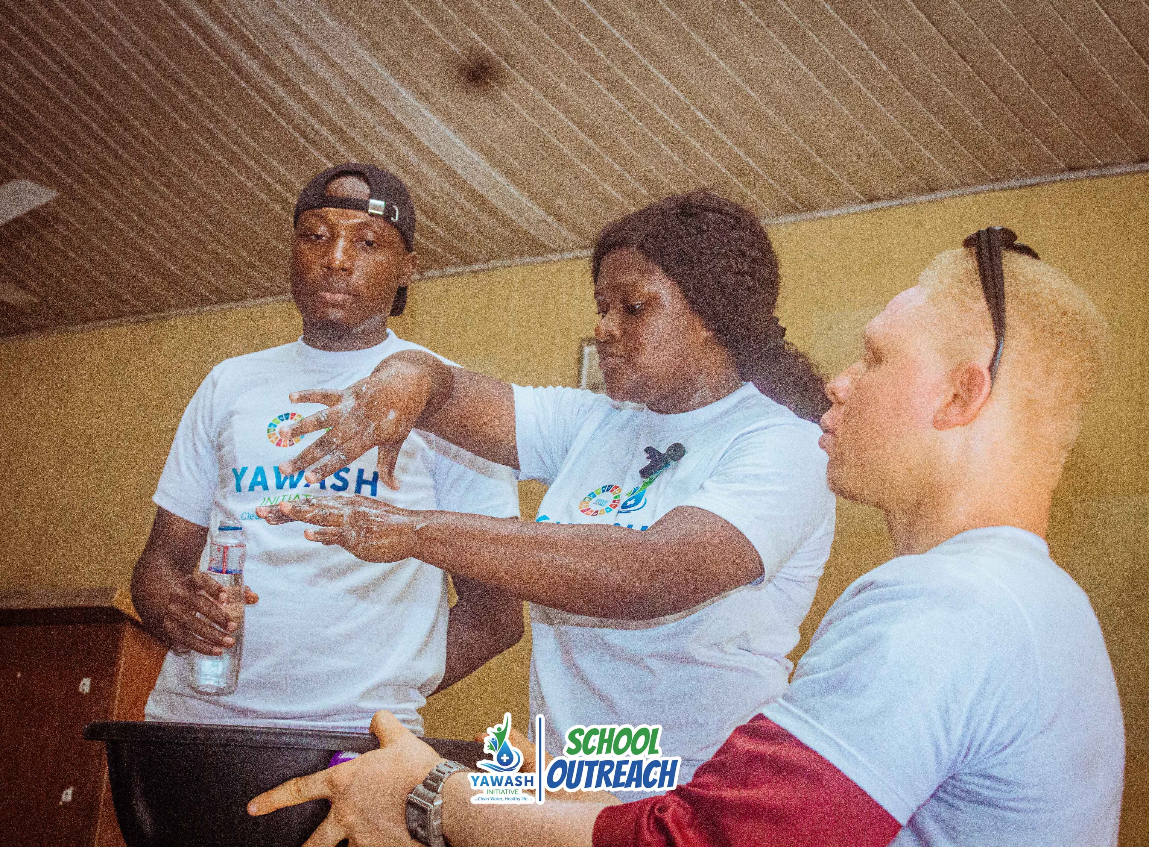 YAWASH outreach volunteers engaging with local community members